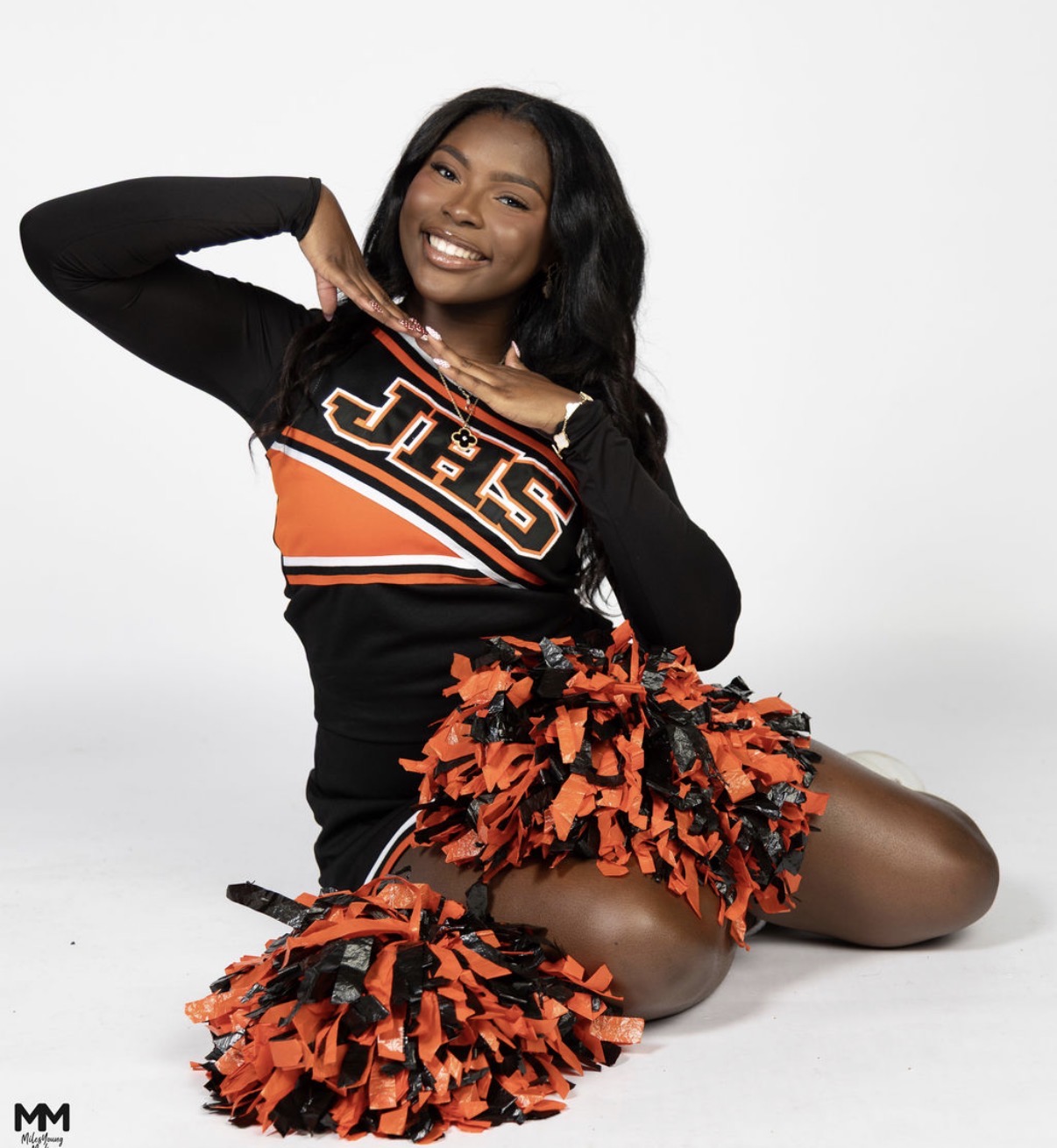 Grace cheerleader with pom poms