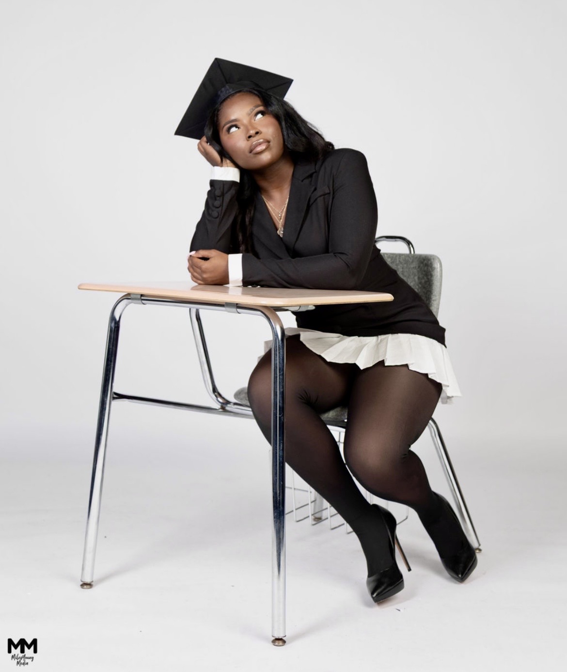 Grace at school desk dreaming
